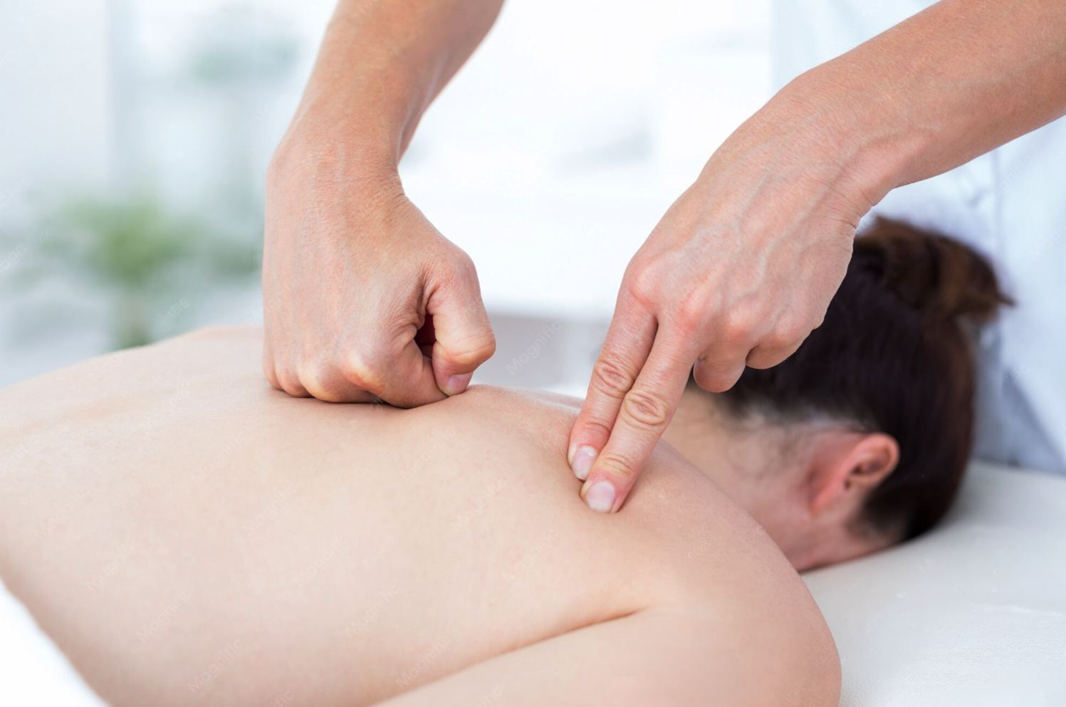 Therapist performing a gentle Swedish massage on a guest's back at Blue Bay SPA Winter Park