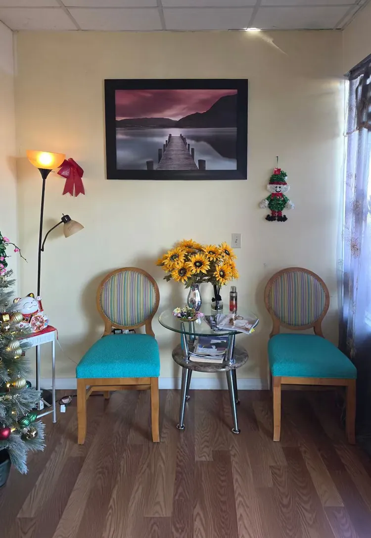Waiting area with two teal chairs at Blue Bay Massage Spa in Winter Park, FL